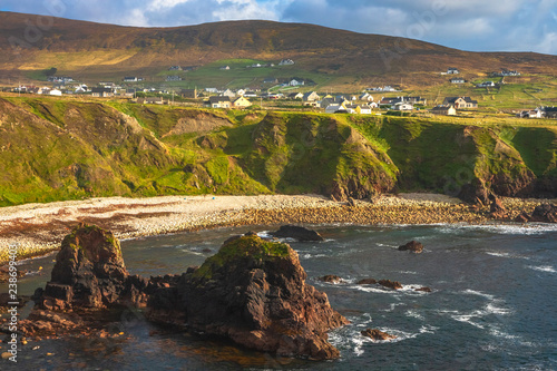 Dramatic coastal landscape at Bloody Foreland, Donegal, Ireland. Natural red granite cliffs at sunset on the Wild Atlantic Way