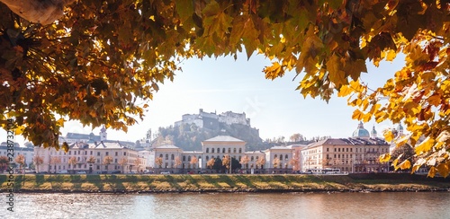 Wide autumn cityscape panorama of Salzburg, Austria. Castle in the background