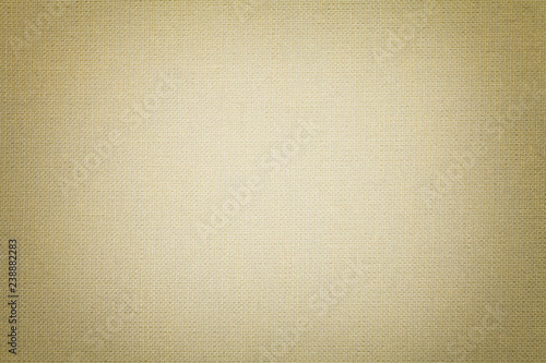 Light beige background from a textile material. Fabric with natural texture. Backdrop.