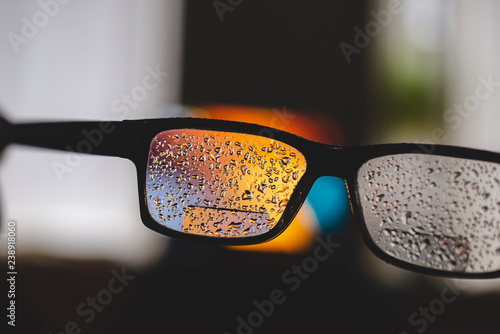 Glasses with the water drops after short walk in the rainy day