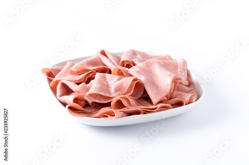 Mortadella slices on white plate isolated on white background