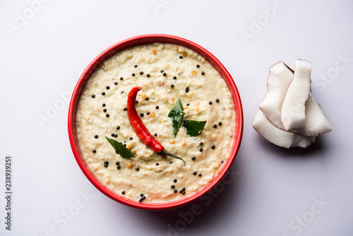 Nariyal or Coconut Chutney served in a bowl. Isolated over moody background. selective focus