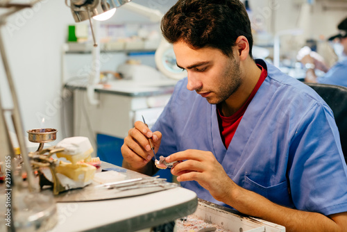 Caucasian man working on a dental prosthesis