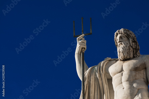 Neptune God of the Sea. Marble statue with trident erected in 1823 in People's Square in Rome (with copy space)