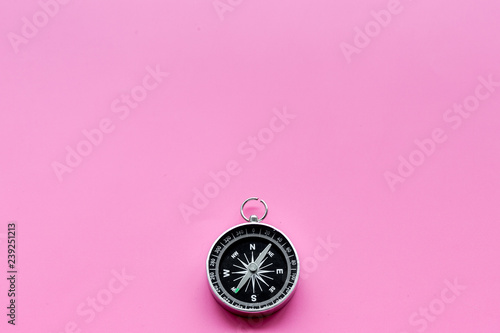 direction and movement concept with compass on pink background top view mock up