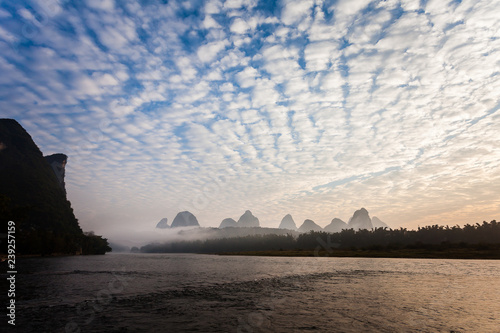 Early morning altocumulus clouds and river scene