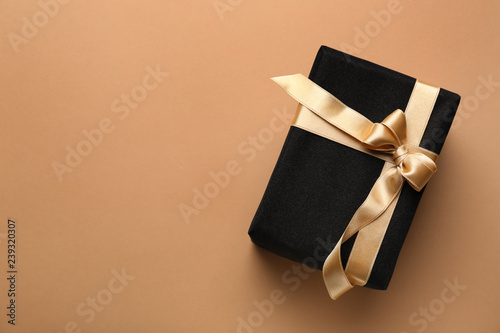 Beautiful gift box on color background