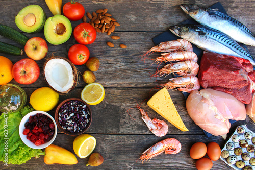  Healthy food of animal and vegetable origin on old wooden background. Concept of proper nutrition. Top view. Flat lay.