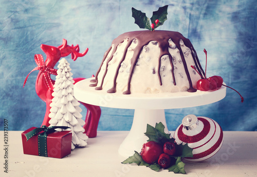 Summertime Christmas Ice Cream Plum Pudding on white cake stand with reindeer and ornaments, with applied retro film filter.