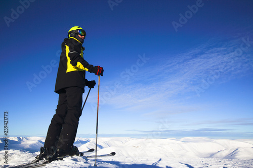 Skier on mountain peak