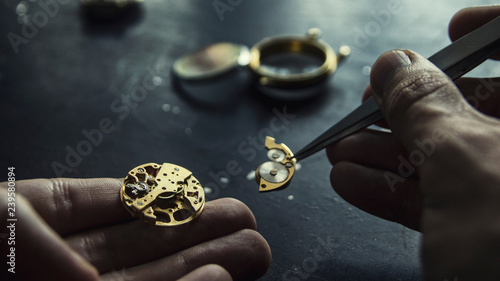 Watch maker is repairing a vintage automatic watch.