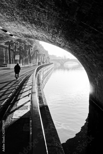 Cyclist and seine river quay in Paris