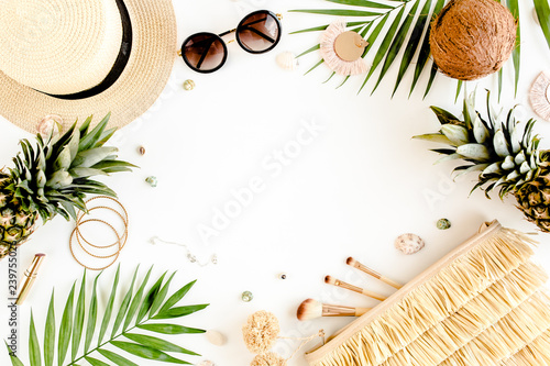 Female, summer street style. Women's frame of accessories. Straw hat, bag, sunglasses and pineapple. Top view, flat lay.