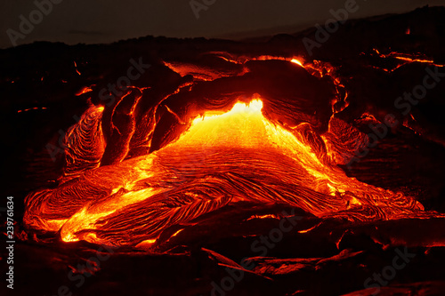 Detailed view of an active lava flow, hot magma emerges from a crack in the earth, the glowing lava appears in strong yellows and reds - Location: Hawaii, Big Island, volcano "Kilauea"