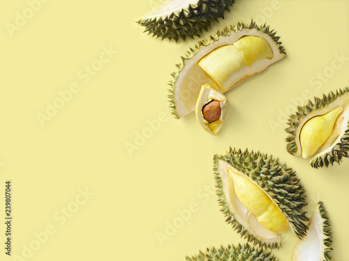 Fresh cut durian on a pastel yellow background, king of fruit from Thailand, creative food concept