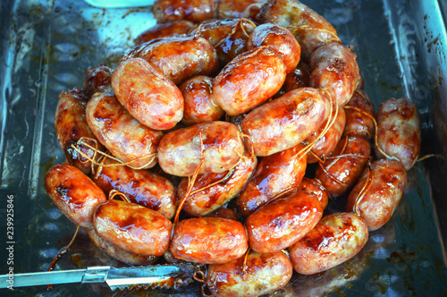 sausage grilled Thai traditional style sausage / Sai krok isan pork and rice in street food - roast sausage round