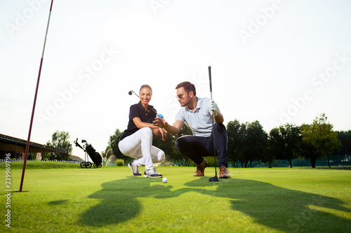 Woman learning how to play golf - Image