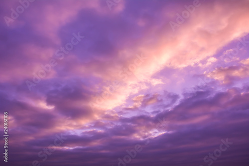 Beautiful nature background. Purple sky with clouds