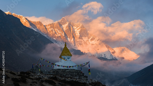 buddhist stupa sunset in the mountains