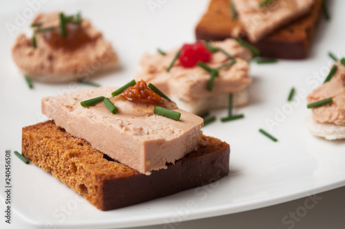 closeup of foie gras on gingerbread in festive plate