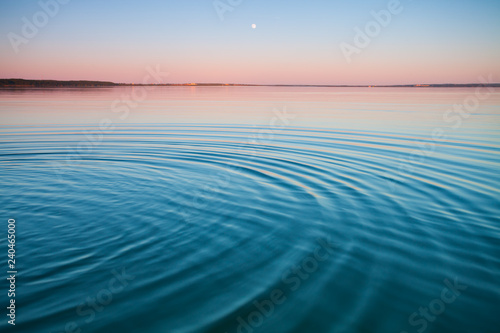 The turquoise lake at dawn.small symmetrical waves