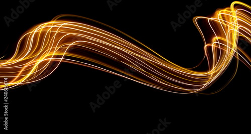 Long exposure light painting photography, curvy lines of vibrant neon metallic yellow gold against a black background