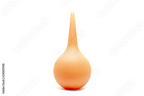 orange rubber enema isolated on a white background