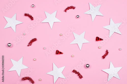 Festive pink background of Christmas accessories.