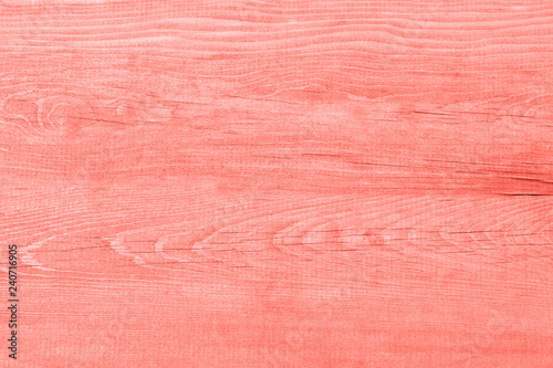 Color of the year 2019 living coral.Wood texture background living coral colored. Trend color concept of the year.