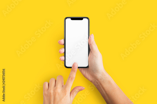 Mockup of female hand holding cell phone with blank screen