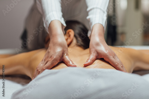 Woman Enjoying a Back Massage .