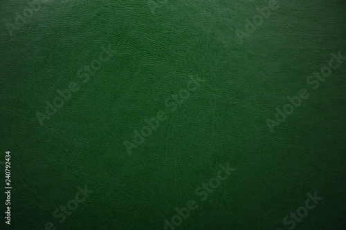 Green textured leather background. Abstract leather texture.