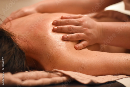 Woman having back massage. Body care, woman having massage in spa
