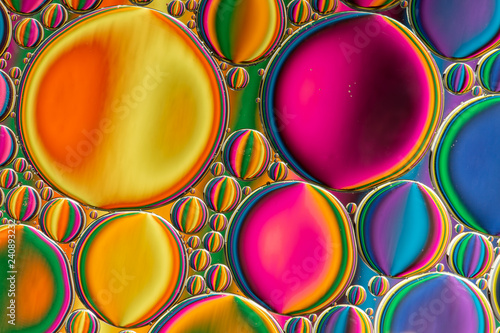 Abstract background of colorful oil drops on water