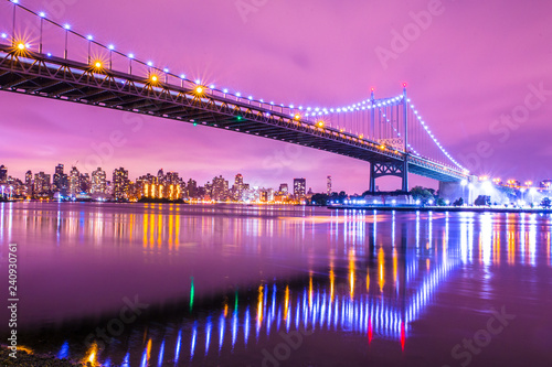 View of RFK Triborough Bridge from Astoria Queens towards Roosevelt Island and Manhattan New York City seen at night