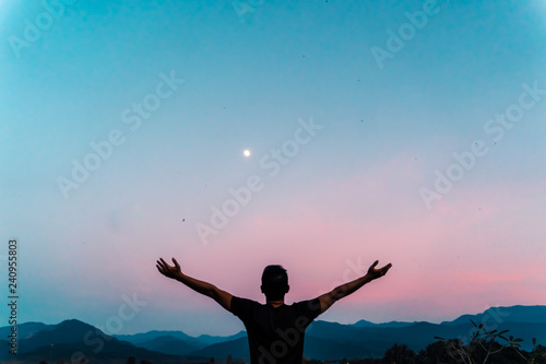 Man rise hands up to sky freedom concept with blue sky.