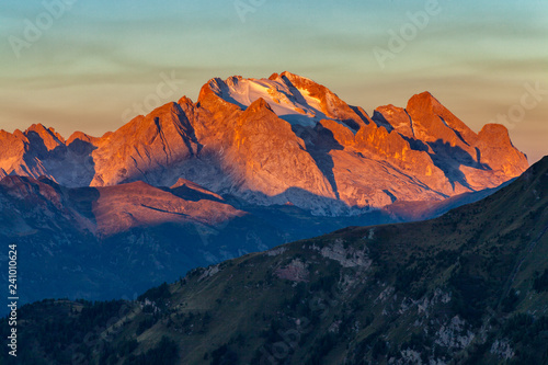 Colorful sunrise over Marmolada, the highest mountain in the Dolomites, Italy