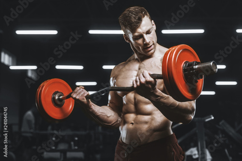 Handsome strong athletic men pumping up muscles workout barbell curl bodybuilding concept background
