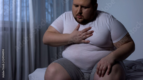 Overweight man feeling chest pain, health body care, heart attack, dyspnea