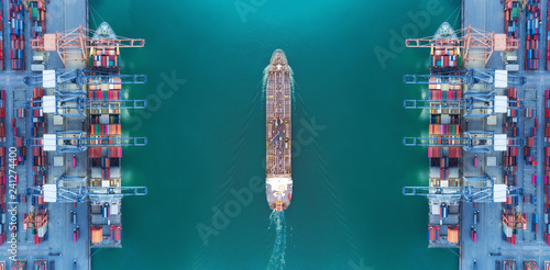 Aerial view panoramic oil tanker moving pass sea port warehouse and container ship or crane ship working for delivery containers shipment.