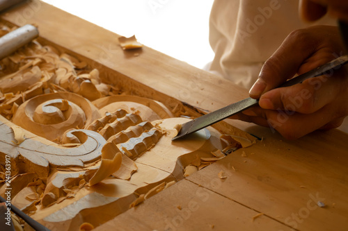 Wood carving in Thailand craftsman.