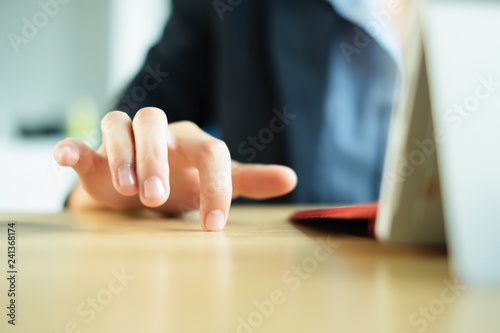 Anxious Woman Impatiently Tapping Fingers on Her Office Desk