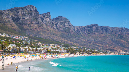 View Camps bay beautiful beach with turquoise water and mountains in Cape Town, South Africa