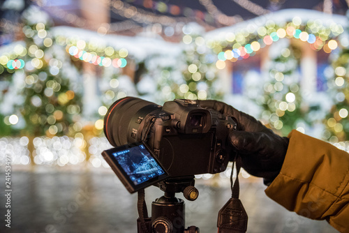 Red Square, Moscow, Russia - December 29, 2018: A photographer is shooting a new 30.1 megapixel full-frame mirrorless interchangeable-lens camera Canon EOS R