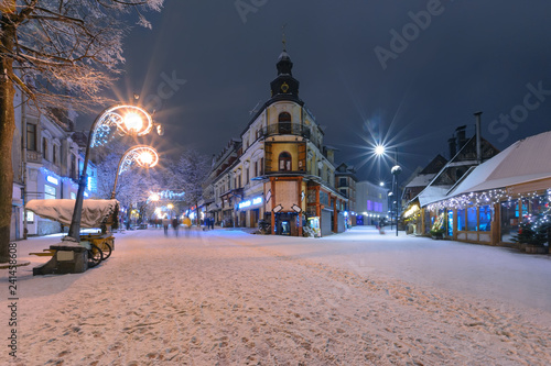 Main street in Zakopane in the snow evening