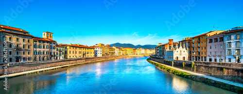 Pisa, Arno river sunset. Lungarno and Santa Maria della Spina church. Tuscany, Italy