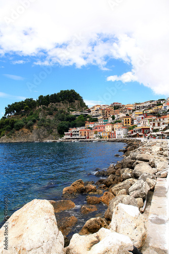 Beautiful view of colorful houses, rocks and fortress in Parga, Greece
