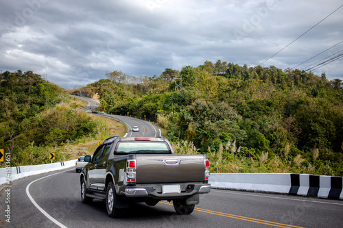 Cars running on the beautiful road along the mountain