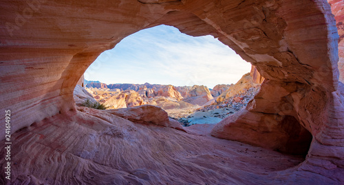 Arch Canyon window to the Valley with the bluesky and colorful sandstone reflection with sunray