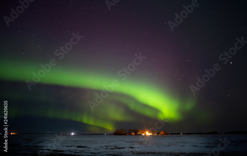 Colorful northern lights over a saskatchewan prairies winter landscape at night